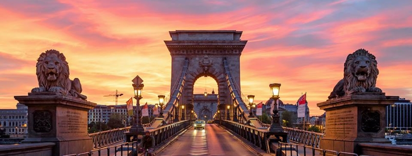 Sunset photo of the first permanent bridge connecting Pest and Buda, the iconic Chain bridge