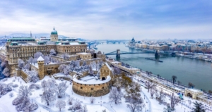 Aerial view of Buda with the Castle district and Pest with the Parliament and the river Danube in wintertime